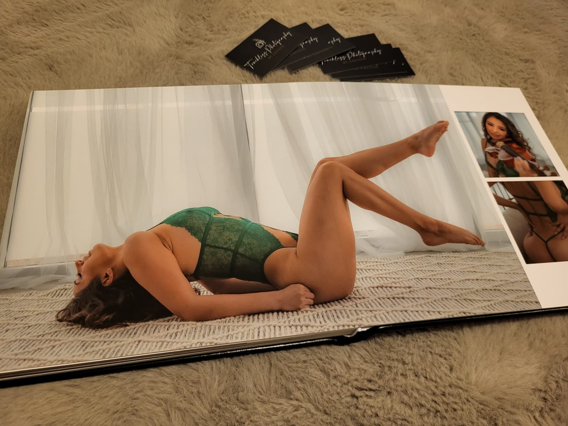 An open album spread, green lace across both pages